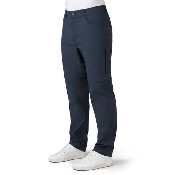 Front view of men's hiking pants with zip off legs showing nylon stretch fabric and elastic waistband