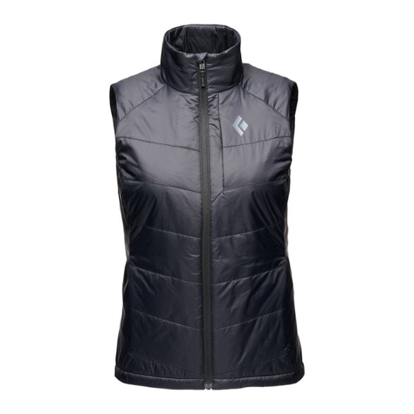 Black Diamond Women's Packable Insulated Vest in black, displayed outdoors with hiking gear.