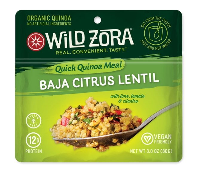 Vibrant Citrus Quinoa & Lentil Bowl on a wooden table, highlighting its freshness and vibrant ingredients.