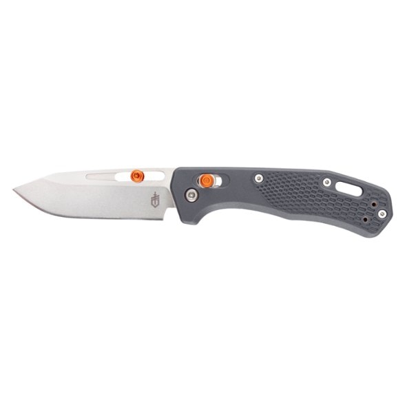 Gerber Assert Tactical Folding Knife displayed outdoors, highlighting its rugged design.