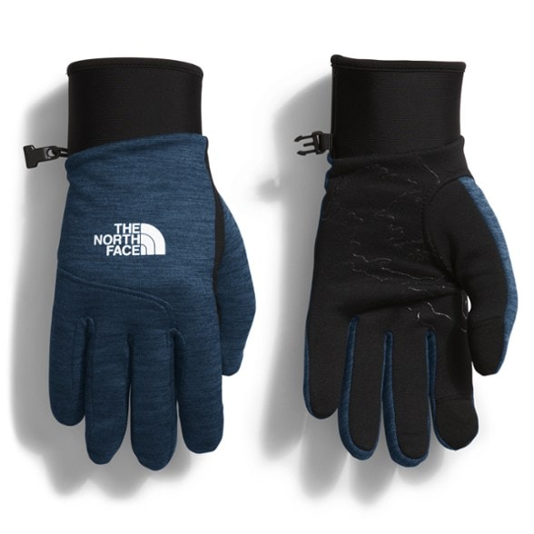Canyonlands gloves on a hiker's hands while using a smartphone, showcasing touchscreen compatibility.