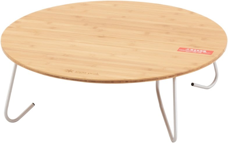 Elegant bamboo folding camping table set up for a picnic with friends