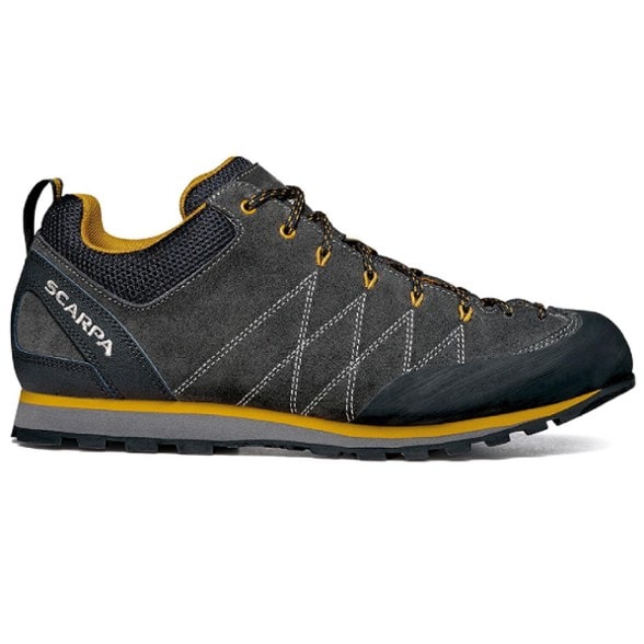 Scarpa Crux Pro approach shoes angled side view showing suede upper and full rubber toe rand.