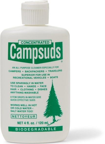 Eco-Camp soap bottle against a scenic camping backdrop