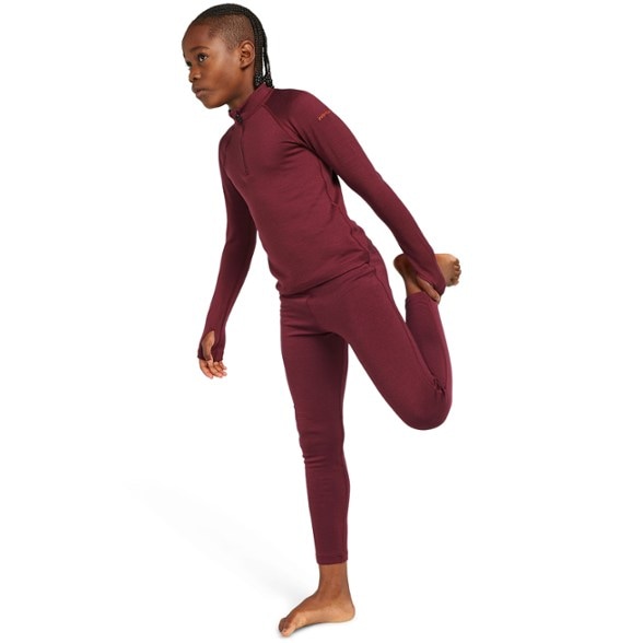 Icebreaker Kids' Merino 260 Thermal Leggings in action during a ski trip.