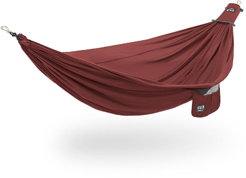 EcoNest hammock set up between trees in a serene forest setting