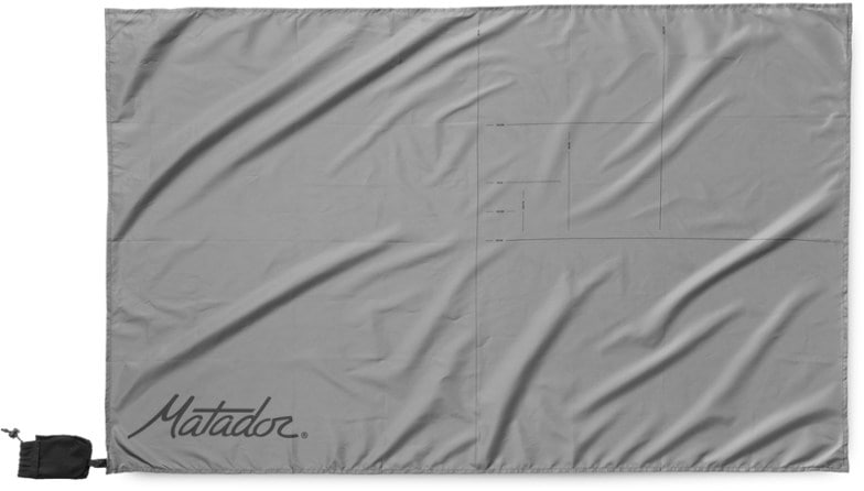 TravelMate Waterproof Pocket Blanket unfolded on grass