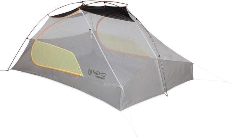 NEMO Mayfly OSMO tent set up in a forest, showcasing spacious interior and waterproof design.