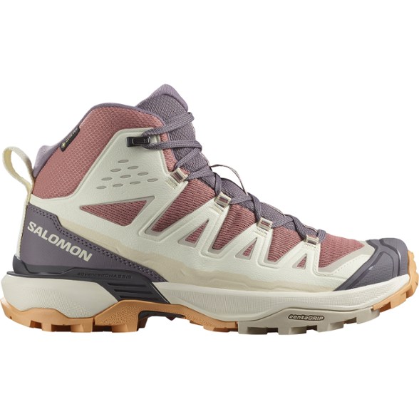 Side view of Salomon Women's X Ultra 360 Edge Mid GORE-TEX Hiking Boots on rocky terrain.