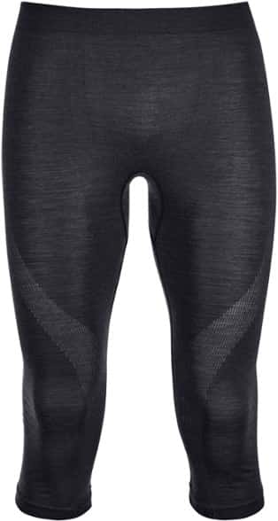 Men's lightweight base layer pants in action during skiing