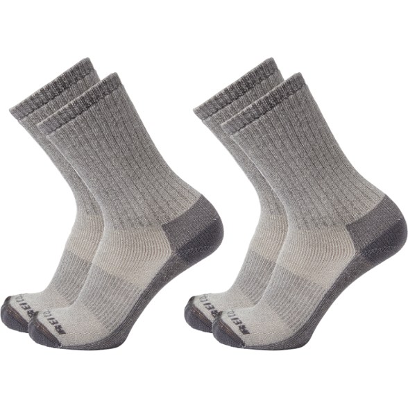 Merino wool hiking crew socks showing a reinforced heel and toe design for durability.