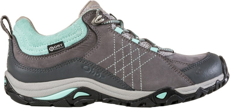 Sapphire Women's hiking shoes displayed on a rocky trail, showcasing their durability and waterproof features.
