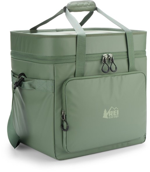 Trailgate 30L cooler in use during a camping trip, showcasing the padded shoulder strap.