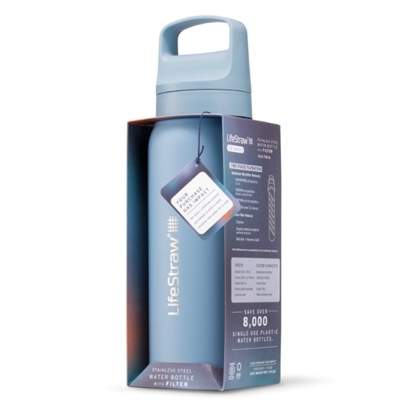 EcoGo insulated water filter bottle in a scenic hiking setting, showcasing its portability.