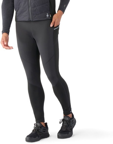Men's merino wool active wind pants shown from the front, ideal for winter training.
