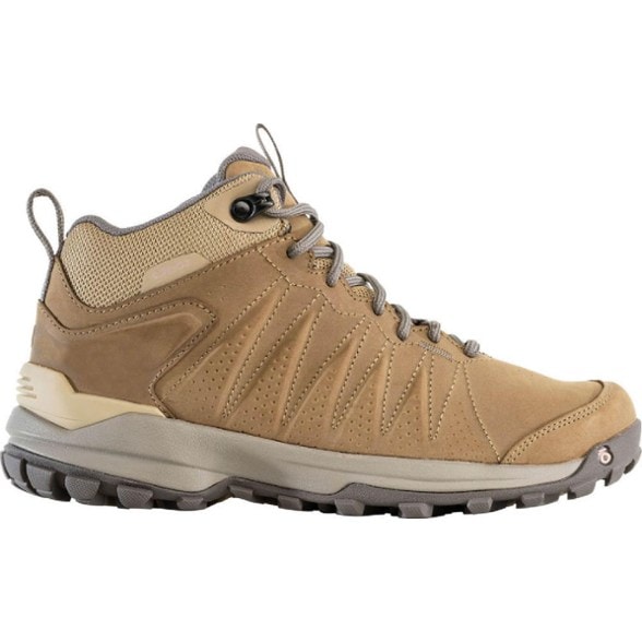 Oboz Women's Sypes Mid Waterproof Hiking Boots showing the lightweight design and supportive features on a rocky trail.