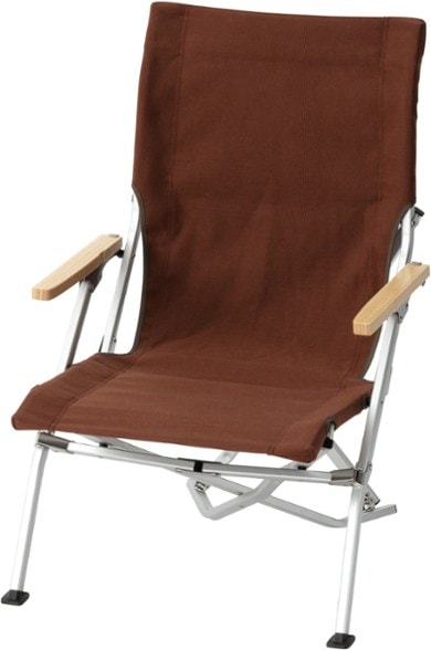 Side view of the Cozy Low Beach Chair set up on the sand, showcasing its low profile and bamboo armrests.