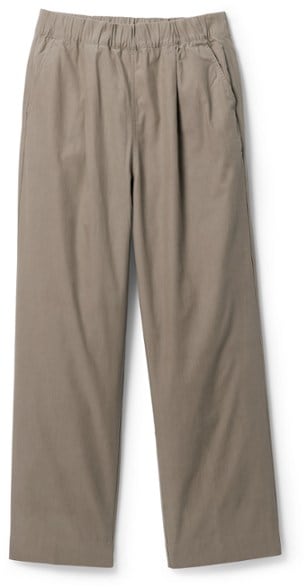 BugsAway Women's Travel Pants in action during a hike with a scenic background.