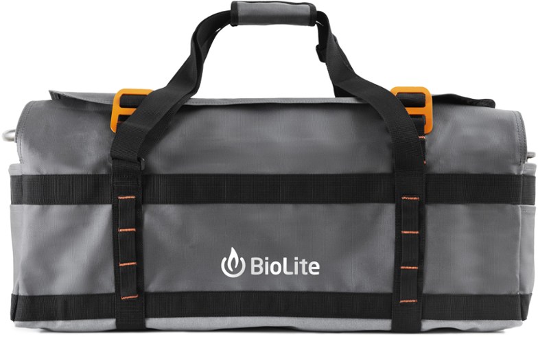 Durable fire pit carry bag displayed outdoors with fire pit and accessories