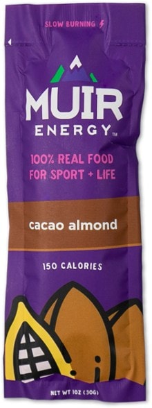 Muir Energy gel in a hand on the track, showcasing fast-burning energy option.