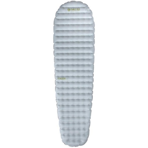 Tensor Elite ultralight sleeping pad fully inflated on rocky ground, showing its slim mummy shape and durable fabric