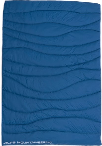 Folded TrailGlow camping blanket showing compact size and water-resistant shell