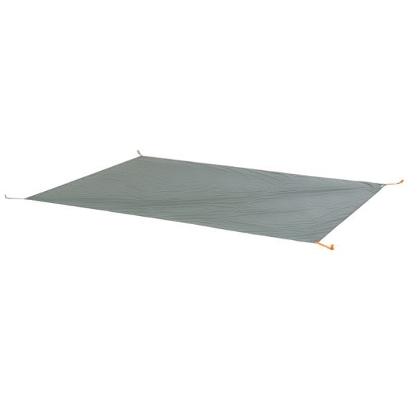 Top-down view of tent footprint laid out near the Blacktail 3 tent, showing clean edges and reinforced corners
