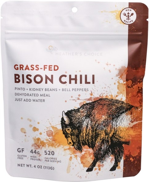 Savory grass-fed bison chili in a camping setting, showcasing its rich color and texture.