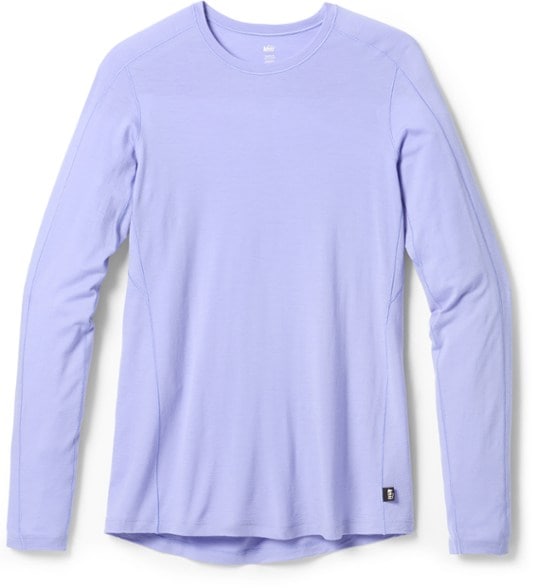 Front view of TrailWool 185 women's thermal shirt worn in hiking conditions