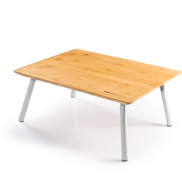 Rakau bamboo picnic table with wine glass holders set up at a campsite.