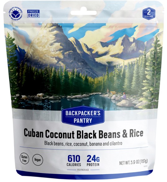 Front view of coconut rice and black beans freeze dried pouch set on a hiking rock.