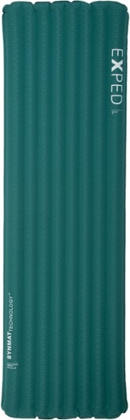 Dura 3R Adventure Sleeping Pad laid out in a campsite, showcasing its thickness and comfort.
