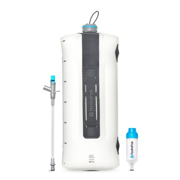 HydraPak Seeker+ 6L portable water filter hanging at a campsite, showing gravity water filter setup
