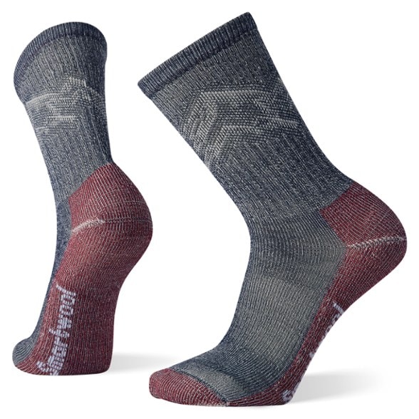 Close-up of eco-friendly merino wool hiking socks showcasing mountain pattern and texture.