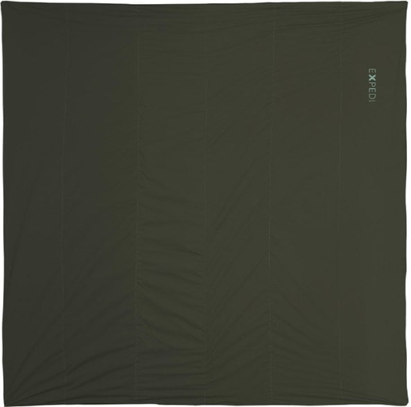 Cozy LuxeWool camping blanket spread out at a campsite, showcasing its luxurious texture and warm colors.
