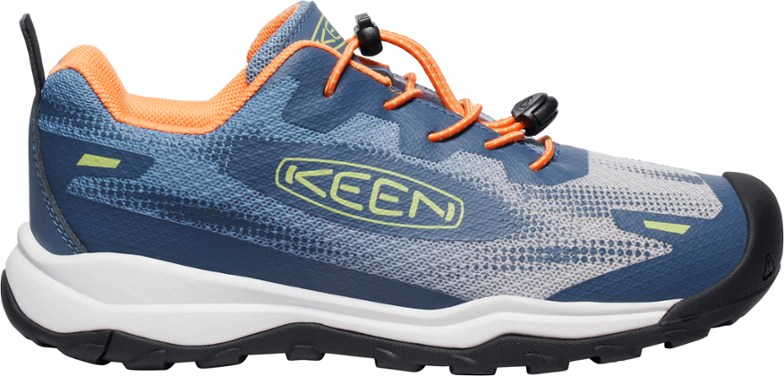 Wanduro Speed hiking shoes for kids in action on a rocky trail.