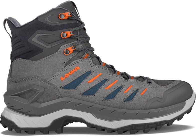 Lowa Innovo GTX Mid hiking boots showcasing aggressive outsoles and supportive design for rugged trails.