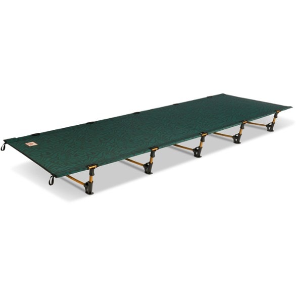 ComfortMax Portable Cot set up in a scenic campsite, showcasing its sturdy design and spacious sleeping area.