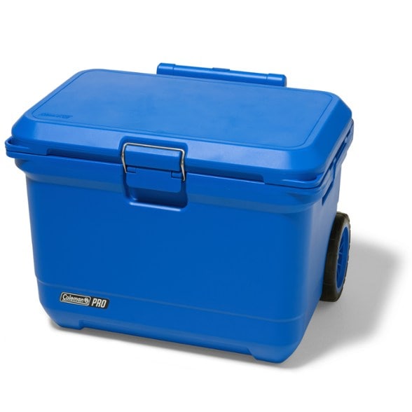 Rugged 55-quart cooler with wheels on the beach, perfect for summer outings.