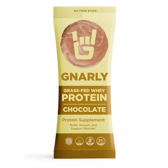 Gnarly Nutrition grass-fed whey protein powder in a scoop, ideal for post workout recovery.