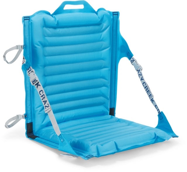 AirComfort inflatable chair in use at a campsite, showcasing its portability and comfort.