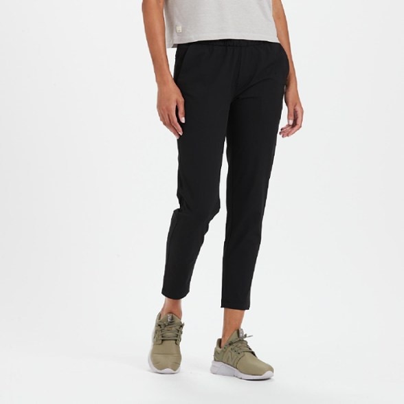 Side view of Vuori AirFlex Miles ankle pants worn during yoga in studio