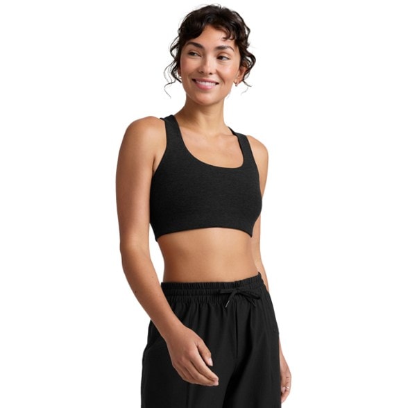 Racerback support bra worn during a yoga class, showcasing its stretch and comfort.