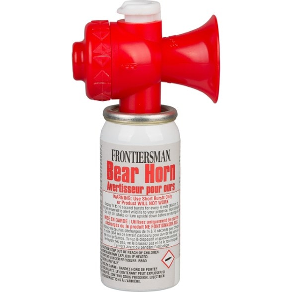 TrailSafe Bear Alert Horn showcased on a hiking backpack.