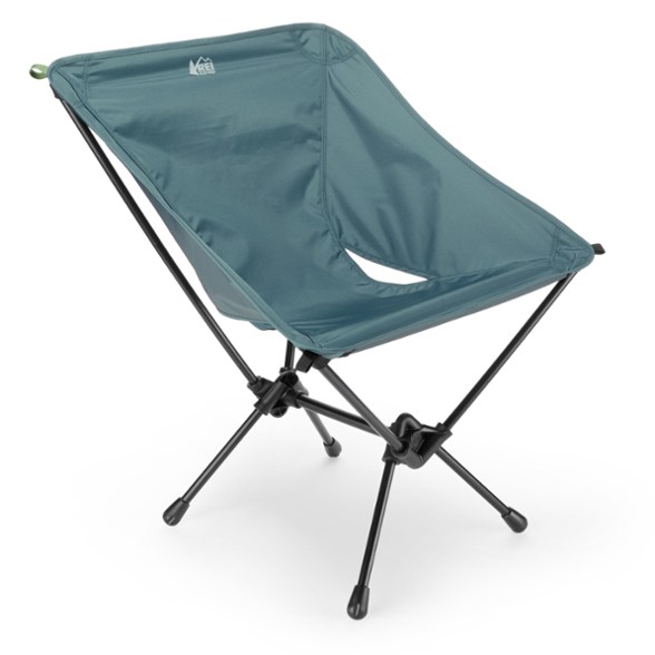 Ultimate Camp Boss Chair in a forest setting, highlighting its spaciousness and stability.