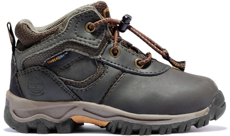 Timberland Mt. Maddsen Kids Waterproof Hiking Boots from the side, showcasing the waterproof design and sturdy construction.