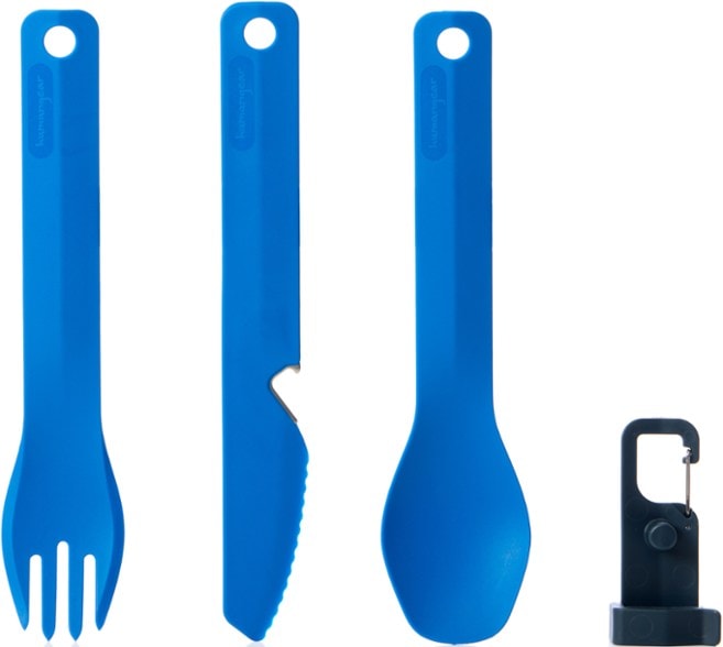 Eco-friendly travel utensil set displayed on a picnic blanket, showcasing the knife, fork, and spoon.