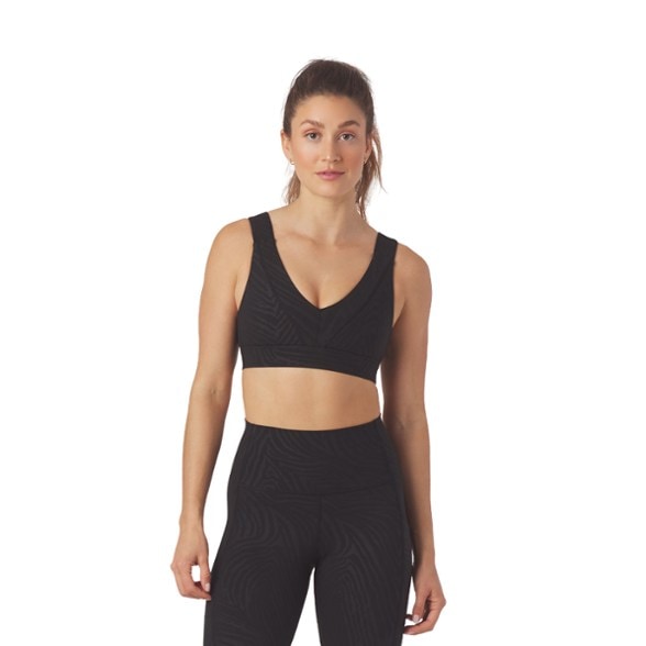 Glyder Tide Running Bra in action during a running session, showcasing its secure fit and style.