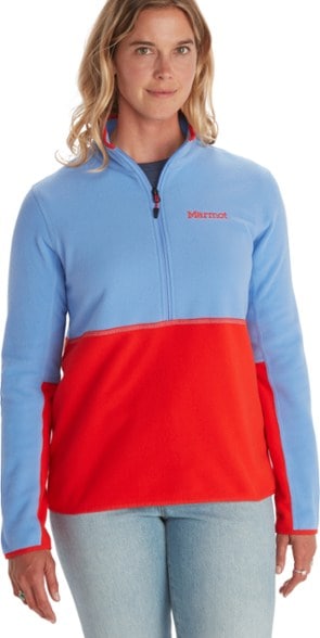 Marmot women's fleece pullover shown in a hiking environment, showcasing its stylish half-zip design.