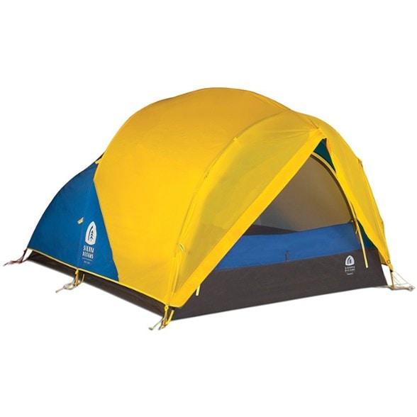 Front view of the Sierra Designs Convert 2 tent in a winter setting, highlighting its spacious interior and sturdy design.